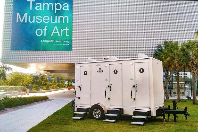 Portable restroom trailer outside of the Tampa Museum of Art