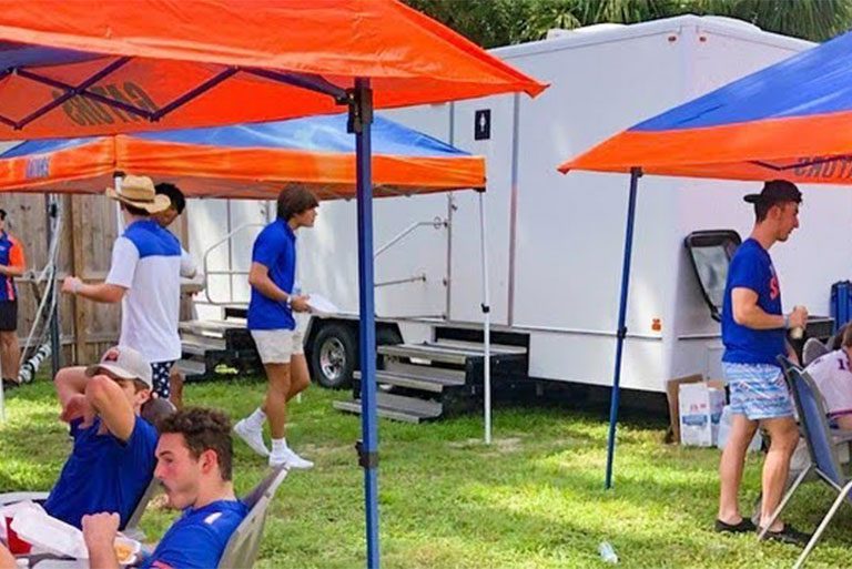 Portable restroom trailer at tailgate
